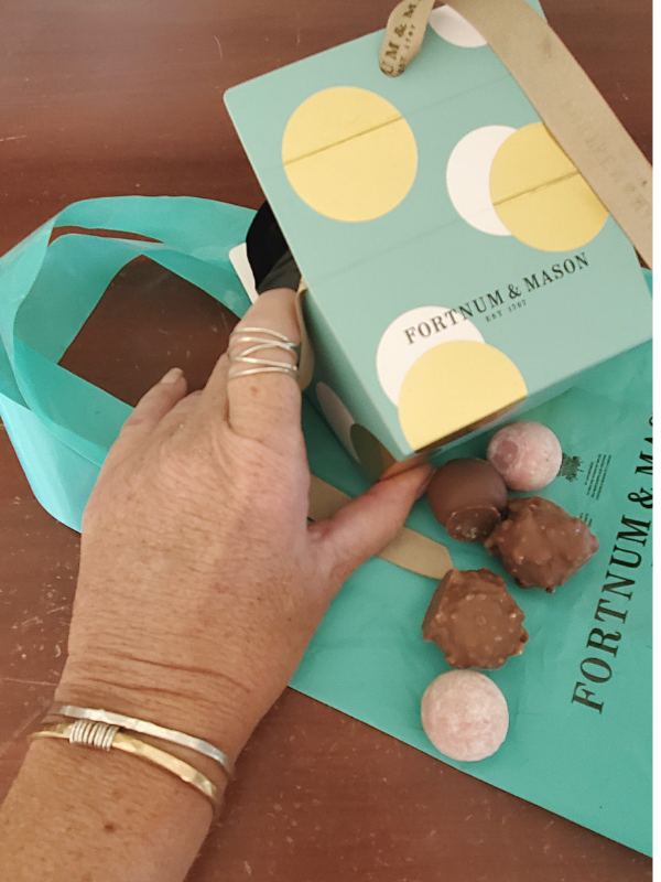 silver & gold jewelry with Fortnum & Mason truffles